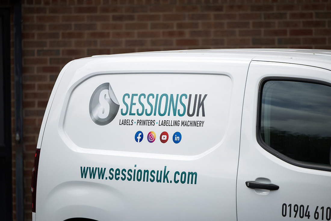 The rear of the Sessions UK van showing the logo, web address and phone number.